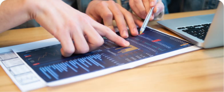 Two people reviewing analytics data on a tablet